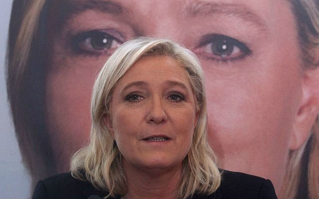 French far-right leader and National Front Party, Marine Le Pen, addresses the media during a news conference, Monday, December 7, 2015, in Lille, northern France. (AP Photo/Michel Spingler)