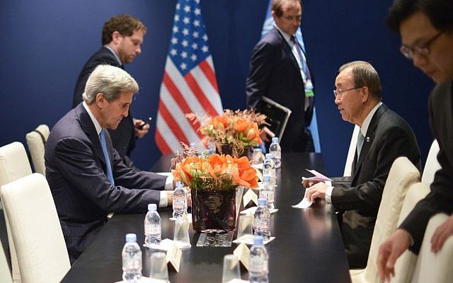 US Secretary of State John Kerry, left, and United Nations Secretary General Ban Ki-moon meet on the sidelines of the United Nations climate change conference, in Le Bourget, on the outskirts of Paris on Friday Dec. 11, 2015. (Mandel Ngan, Pool via AP)