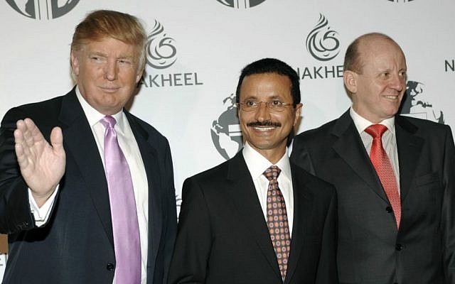 In this Aug. 23, 2008, file photo, Donald Trump, left, His Excellency Sultan Ahmed bin Sulayem of Dubai, center, and then-Nakheel CEO Chris O'Donnell pose together at a party thrown by Nakheel and the Trump Organization to introduce The Trump International Hotel & Tower Dubai. (AP Photo/Chris Pizzello, File)