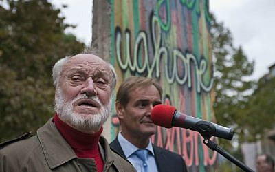 In this Oct. 8, 2009 file photo German conductor Kurt Masur speaks in front of a piece of the former Berlin wall during a ceremony at the Stasi museum in Leipzig, eastern Germany. (AP Photo/Eckehard Schulz, file)