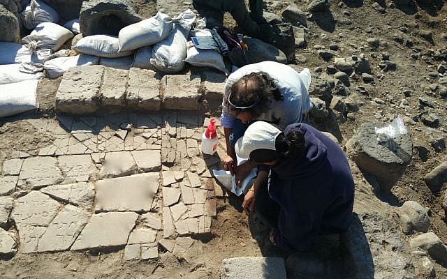 Archaeologists unearth a marble slab bearing a Hebrew inscription found on the shores of the Sea of Galilee at the Byzantine Jewish site of Kursi. (University of Haifa) Archaeologists unearth a marble slab bearing a Hebrew inscription found on the shores of the Sea of Galilee at the Byzantine Jewish site of Kursi. (University of Haifa)