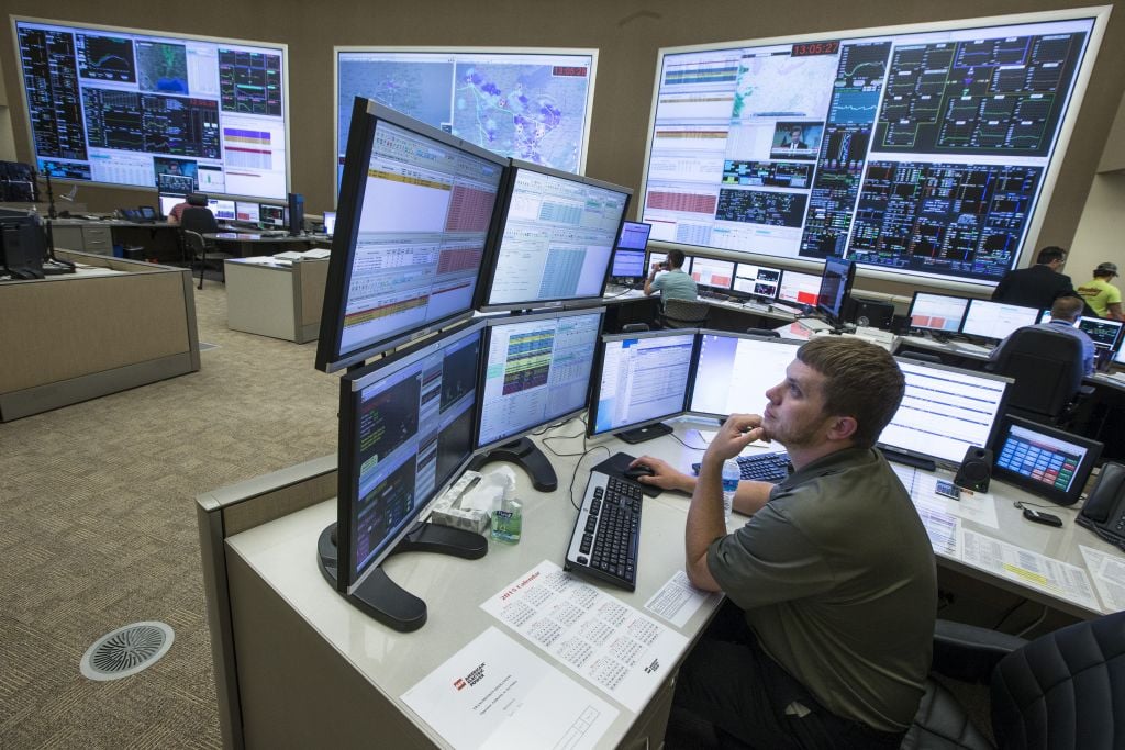 System control center operator Ryan Cox sits at his computer workstation at an AEP Transmission Operations Center in New Albany, Ohio on May 20, 2015. (AP Photo/John Minchillo) System control center operator Ryan Cox sits at his computer workstation at an AEP Transmission Operations Center in New Albany, Ohio on May 20, 2015. (AP Photo/John Minchillo)