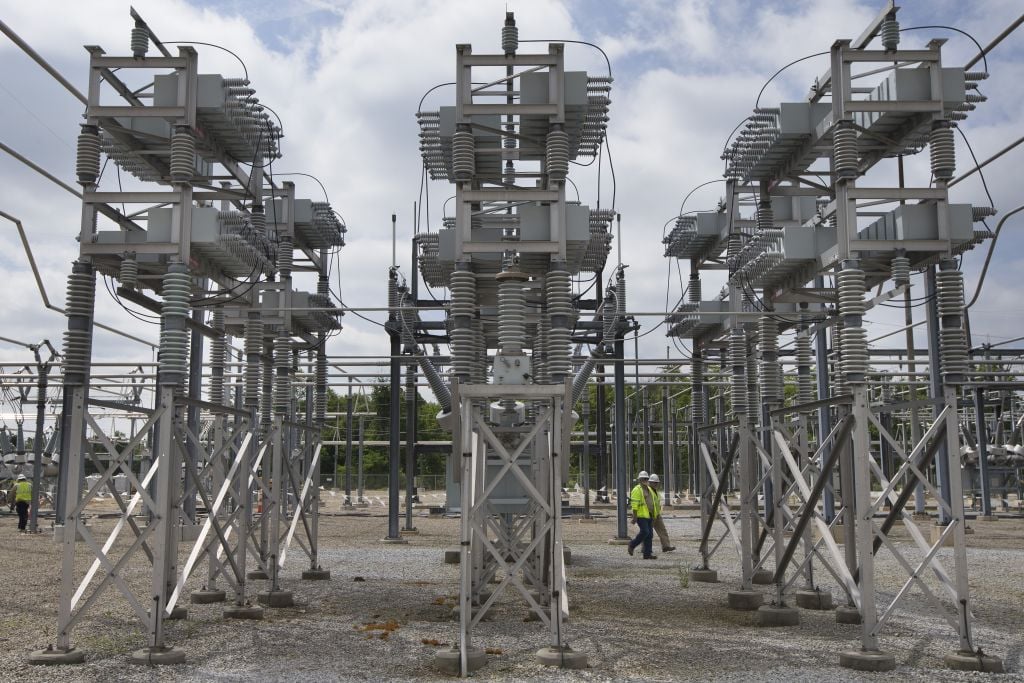 Contractors walk past a capacitor bank at an AEP electrical transmission substation in Westerville, Ohio on May 20, 2015. (AP Photo/John Minchillo) Contractors walk past a capacitor bank at an AEP electrical transmission substation in Westerville, Ohio on May 20, 2015. (AP Photo/John Minchillo)