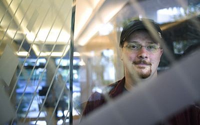 In this Oct. 21, 2015 photo, Brian Wallace, a security researcher at Cylance, poses for a photo in Irvine, Calif. Wallace was on the trail of hackers who had snatched a California university's housing files when he stumbled into a larger nightmare: Cyberattackers had opened a pathway into the networks running the United States power grid. (AP Photo/Jae C. Hong) In this Oct. 21, 2015 photo, Brian Wallace, a security researcher at Cylance, poses for a photo in Irvine, Calif. Wallace was on the trail of hackers who had snatched a California university's housing files when he stumbled into a larger nightmare: Cyberattackers had opened a pathway into the networks running the United States power grid. (AP Photo/Jae C. Hong)