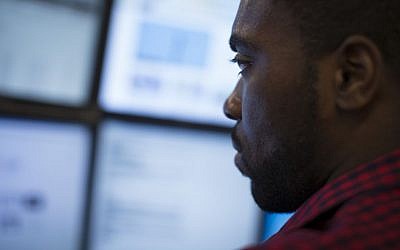Eric Dinkins, cyber security analyst associate, works at a computer station in the Cyber Security Operations Center at AEP headquarters in Columbus, Ohio on May 20, 2015. (AP Photo/John Minchillo) Eric Dinkins, cyber security analyst associate, works at a computer station in the Cyber Security Operations Center at AEP headquarters in Columbus, Ohio on May 20, 2015. (AP Photo/John Minchillo)