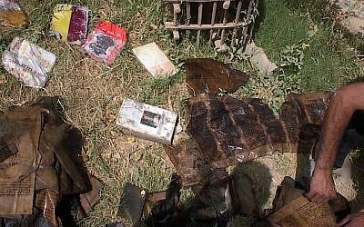 Books from the Jewish community of Iraq shown drying in the sun after their rescue from the flooded basement headquarters of Saddam Hussein's secret police on May 6, 2003, Baghdad, Iraq. (Courtesy: Harold Rhode)