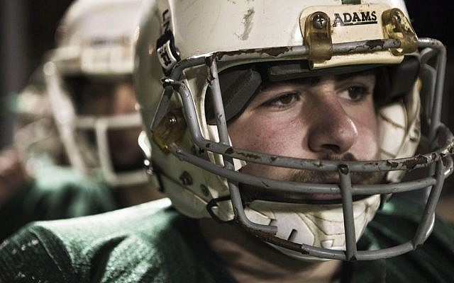 A member of the high school football team Kfar Saba Hawks,in green shirts, play against Mazkeret Batya Gorillas in Kfar Saba, Israel, December 10, 2015. (Photo by AP Photo/Dan Balilty) A member of the high school football team Kfar Saba Hawks,in green shirts, play against Mazkeret Batya Gorillas in Kfar Saba, Israel, December 10, 2015. (Photo by AP Photo/Dan Balilty)
