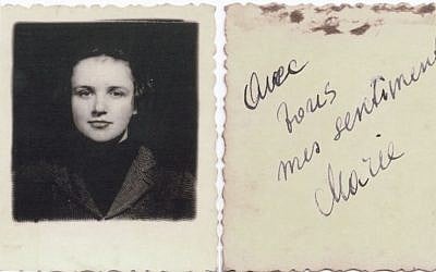 This undated picture provided by Akira Kitade from an album owned by Tatsuo Osako, a former colleague of Kitade's at the Japan Tourist Bureau, shows a woman and an accompanying message on the back signed by Marie, reading "avec tous mes sentiments" in French, or "with all my affections." (Akira Kitade via AP) 
