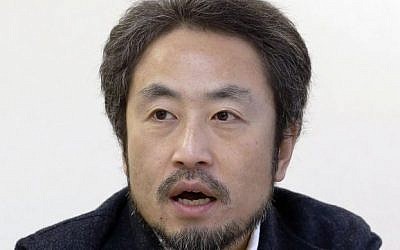 In this February 18, 2015 photo, Japanese freelance journalist Jumpei Yasuda speaks during an interview in Tokyo. (Kyodo News via AP)
