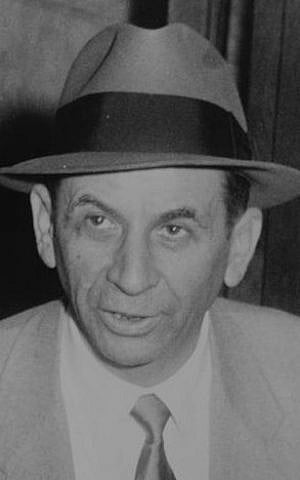 Meyer Lansky at a New York City police station, where he is being booked for vagrancy, 1958 (Wikimedia Commons/JTA)