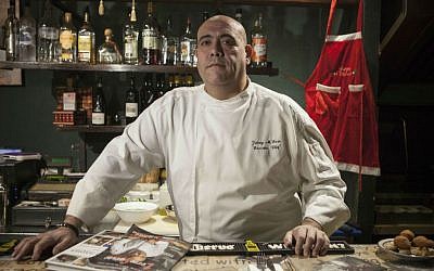 In this photo taken Tuesday, Dec. 8, 2015, Israeli Arab chef Johnny Goric poses during a Arab Food Festival in Haifa, Israel. (AP Photo/Dan Balilty)