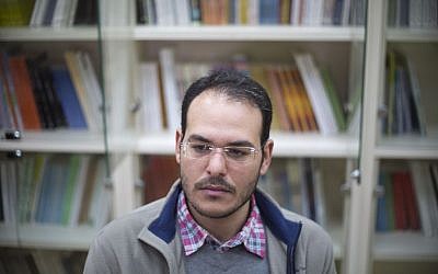 Avihay Marciano, 26, a former ultra-Orthodox Jew, sits during an interview with The Associated Press at an open university campus in Beersheva, Israel, December 15, 2015. (AP/Ariel Schalit)