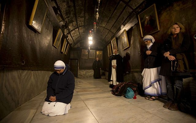 A nun prays inside the Grotto at the Church of the Nativity, traditionally believed by Christians to be the birthplace of Jesus Christ, in the West Bank city of Bethlehem on Christmas Eve, Thursday, Dec.ember 24, 2015 (AP Photo/Majdi Mohammed) A nun prays inside the Grotto at the Church of the Nativity, traditionally believed by Christians to be the birthplace of Jesus Christ, in the West Bank city of Bethlehem on Christmas Eve, Thursday, Dec.ember 24, 2015 (AP Photo/Majdi Mohammed)