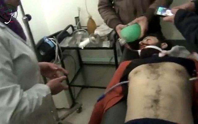 This image made from video made available by the Media Center in Moadamiyat al-Sham on Wednesday, Dec. 23, 2015, shows a medic helping a patient at a town clinic, after an attack, in Moadamiyeh, southwest of Damascus, Syria. (Media Center in Moadamiyat al-Sham via AP) This image made from video made available by the Media Center in Moadamiyat al-Sham on Wednesday, Dec. 23, 2015, shows a medic helping a patient at a town clinic, after an attack, in Moadamiyeh, southwest of Damascus, Syria. (Media Center in Moadamiyat al-Sham via AP)