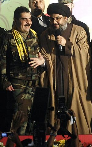 In this July 16, 2008, file photo, Hezbollah leader Hassan Nasrallah, right, gestures as he stands with Samir Kuntar during celebrations in Beirut of Kuntars release from Israeli jail. (AP Photo/File) In this July 16, 2008, file photo, Hezbollah leader Hassan Nasrallah, right, gestures as he stands with Samir Kuntar during celebrations in Beirut of Kuntars release from Israeli jail. (AP Photo/File)