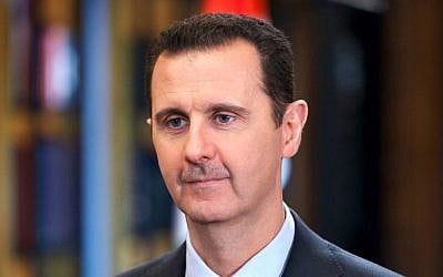 Syrian President Bashar Assad speaks during an interview with Venezuela's state-run Telesur network, in Damascus, Syria, September 25, 2013. (AP/SANA)