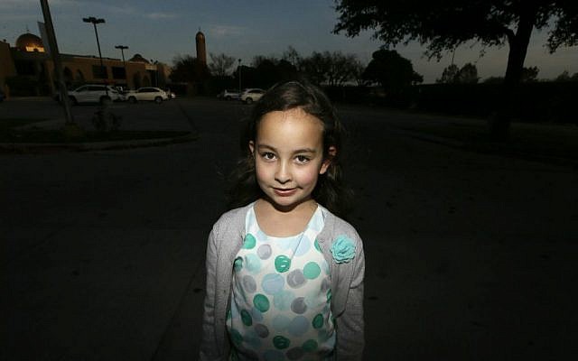 Sofia Yassini, 8, poses for a photo outside a mosque in Richardson, Texas, Friday, Dec. 11, 2015. (AP Photo/LM Otero) Sofia Yassini, 8, poses for a photo outside a mosque in Richardson, Texas, Friday, Dec. 11, 2015. (AP Photo/LM Otero)