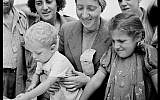 Women and children registering for the Fort Ontario Refugee Camp, August 1944. (public domain via wikipedia)