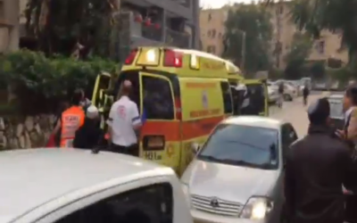Paramedics at the scene of a stabbing on Anielewicz Street in Ra'anana on December 19, 2015. (screen capture: Channel 2)
