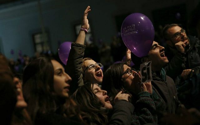 Podemos supporters cheer as they wait for results in Spain's general elections in Madrid, Sunday, Dec. 20, 2015. (AP Photo/Daniel Ochoa de Olza)
