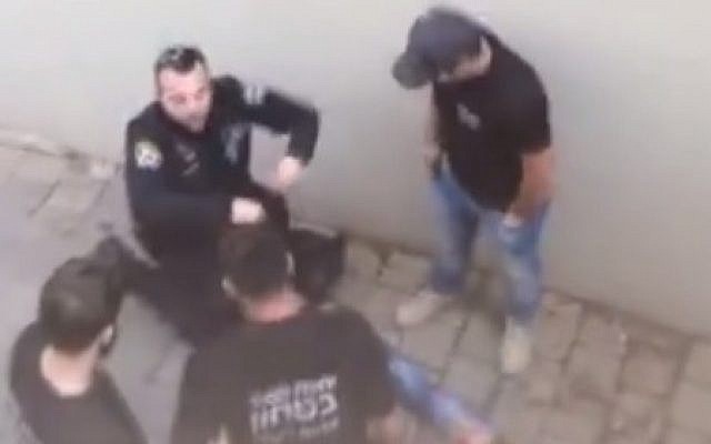 Police officers stand over Mahmoud Faisal Bisharat, a Palestinian who entered Israel illegally and stabbed three people in Ra'anana on December 19, 2015. (Screen capture: Facebook) Police officers stand over Mahmoud Faisal Bisharat, a Palestinian who entered Israel illegally and stabbed three people in Ra'anana on December 19, 2015. (Screen capture: Facebook)