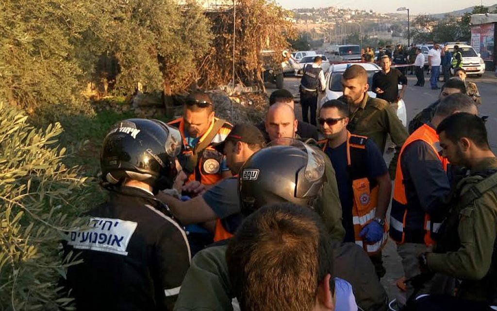 Medical teams at the scene of a car-ramming attack near the West Bank settlement of Beit Aryeh (Ihud Hatzalah)