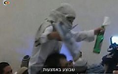 A far-right Israeli wedding-goer celebrates the murder of the Dawabsha family (screen capture: Channel 10)