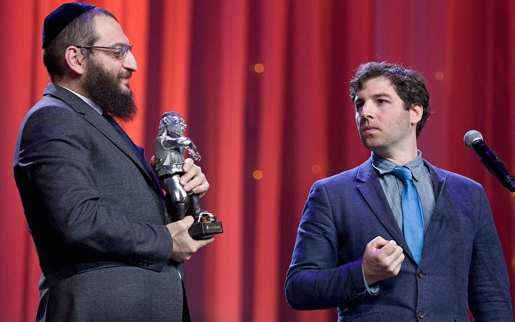 JTA’s Cnaan Liphshiz, right, gets set to accept a Fiddler on the Roof Award from Rabbi Boruch Gorin at the Kremlin, Dec. 8, 2015. (Courtesy of the Federation of Jewish Communities of Russia) JTA’s Cnaan Liphshiz, right, gets set to accept a Fiddler on the Roof Award from Rabbi Boruch Gorin at the Kremlin, Dec. 8, 2015. (Courtesy of the Federation of Jewish Communities of Russia)