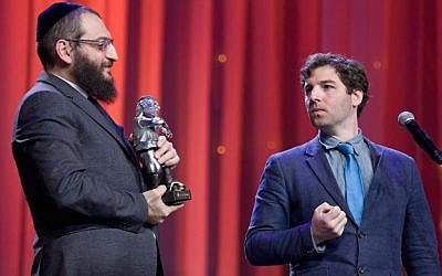 JTA’s Cnaan Liphshiz, right, gets set to accept a Fiddler on the Roof Award from Rabbi Boruch Gorin at the Kremlin, Dec. 8, 2015. (Courtesy of the Federation of Jewish Communities of Russia)