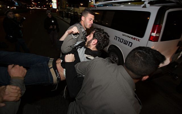 Israeli security forces detain a right wing protester during a demonstration against the arrest of Jewish youth suspected of involvement in the arson attack in the West Bank village of Duma, earlier this summer. December 20, 2015. Photo by Yonatan Sindel/Flash90 Israeli security forces detain a right wing protester during a demonstration against the arrest of Jewish youth suspected of involvement in the arson attack in the West Bank village of Duma, earlier this summer. December 20, 2015. Photo by Yonatan Sindel/Flash90