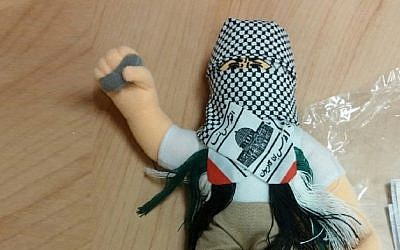 A doll wearing a keffiyah and holding a stone, part of a shipment of 4,000 such dolls heading to the Palestinian Authority which was intercepted by Haifa customs officials, December 8, 2015. (Haifa customs)