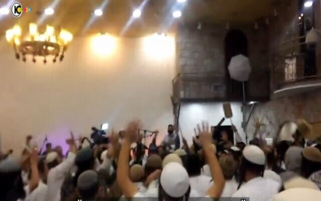 Far-right Israeli wedding-goers celebrate the killings of the Dawabsha family, brandishing rifles and calling for revenge against Palestinians, December 2015. (screen capture: Channel 10) Far-right Israeli wedding-goers celebrate the killings of the Dawabsha family, brandishing rifles and calling for revenge against Palestinians, December 2015. (screen capture: Channel 10)