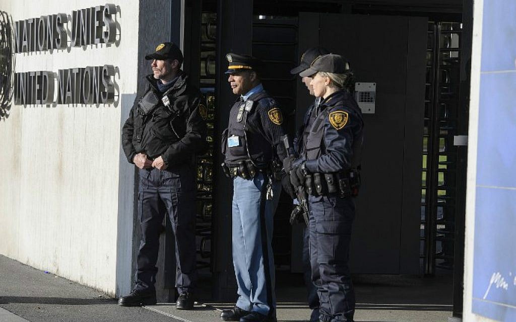 Security forces stand guard at the entrance of the United Nations headquarter in Geneva on December 10, 2015 after Swiss police declared actively searching the city for suspects who may be linked to last month's attacks in Paris. (RICHARD JUILLIARD/AFP)