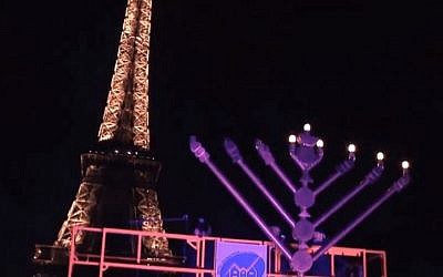 A menorah lighting ceremony at the Eiffel Tower in 2013 (YouTube screen capture)
