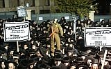 Ultra-Orthodox Jewish men protest against the military draft in Jerusalem's Mea Shearim neighborhood, December 22, 2015. (Yonatan Sindel/Flash90)