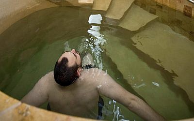 A man using the mikvah at Mayyim Hayyim, a community ritual bath in the Boston suburbs. (Courtesy of Mayyim Hayyim/via JTA)