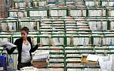 A postal worker stands in the selection hall at a post office in Tel Aviv February, 22, 2010. (Yossi Zeliger/Flash 90)