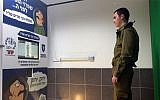 A soldier tries out the IDF's 'selfie' station at the main induction center. (Israel Defense Forces)