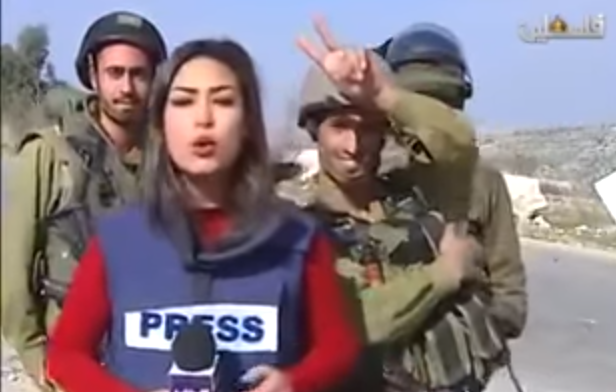 IDF soldiers interrupt the live broadcast of Palestinian journalist Sara Al-Azra, December 14, 2015. (Screenshot from YouTube) IDF soldiers interrupt the live broadcast of Palestinian journalist Sara Al-Azra, December 14, 2015. (Screenshot from YouTube)
