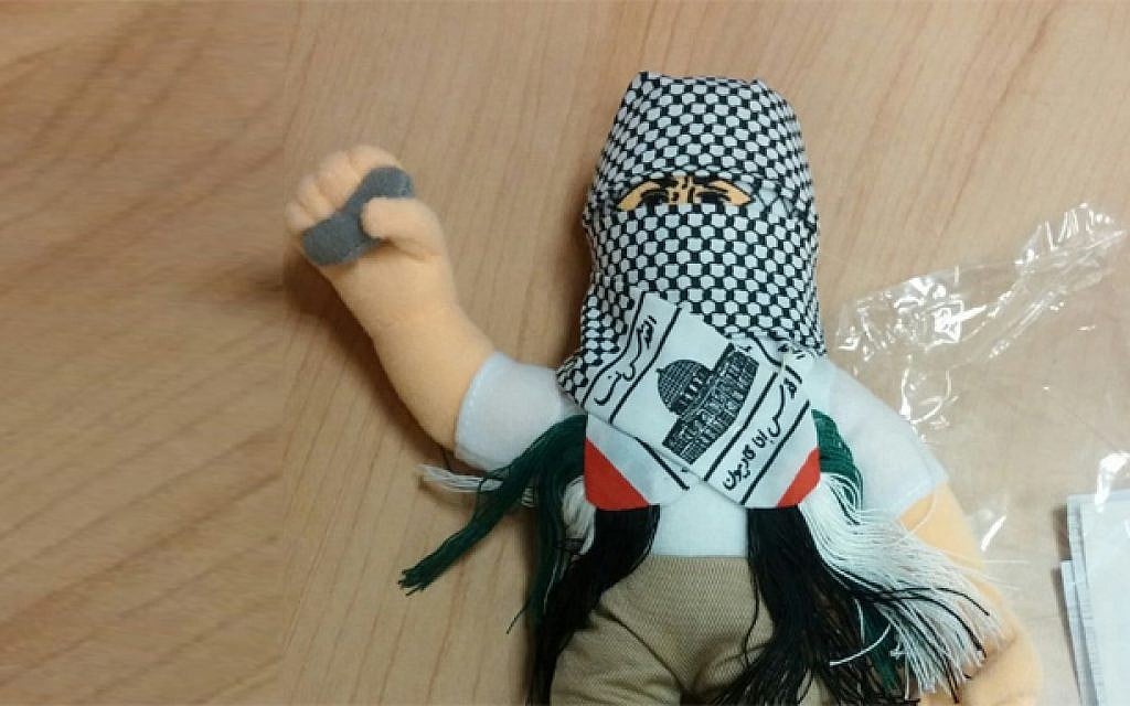 A doll wearing a kufiyah and holding a stone, part of a shipment of 4,000 such dolls heading to the Palestinian Authority which was intercepted by Haifa customs officials, December 8, 2015. (Haifa customs) A doll wearing a kufiyah and holding a stone, part of a shipment of 4,000 such dolls heading to the Palestinian Authority which was intercepted by Haifa customs officials, December 8, 2015. (Haifa customs)