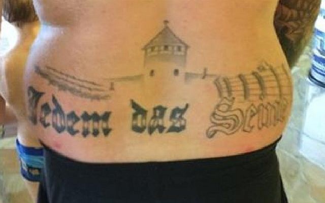 German prosecutors to investigate a man with a tattoo of what appears to be the Auschwitz death camp on his back in a public swimming pool in Oranienburg, eastern Germany on December 1, 2015. (screen capture: YouTube) German prosecutors to investigate a man with a tattoo of what appears to be the Auschwitz death camp on his back in a public swimming pool in Oranienburg, eastern Germany on December 1, 2015. (screen capture: YouTube)