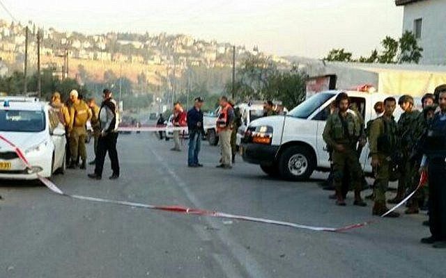 The scene of a car-ramming attack near the Beit Aryeh settlement in the West Bank on December 10, 2015 (Magen David Adom)