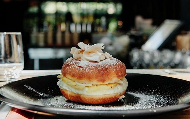 A Tel Aviv restaurant's Asian-inspired coconut cream and pineapple sufganiya (Courtesy Liah Chesnokov) A Tel Aviv restaurant's Asian-inspired coconut cream and pineapple sufganiya (Courtesy Liah Chesnokov)