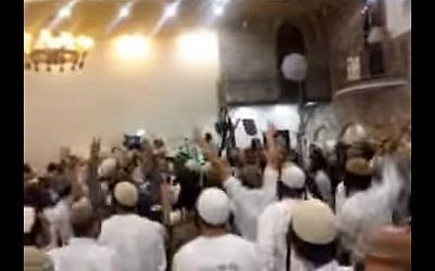 Screenshot from a video showing extremist Israeli Jewish wedding-goers celebrating the killings of the Dawabsha family. (screen capture: Channel 10)
