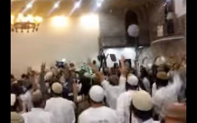 Screenshot from a video showing extremist Israeli Jewish wedding-goers celebrating the killings of the Dawabsha family. (screen capture: Channel 10)