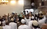 Screenshot from a video showing extremist Israeli Jewish wedding-goers celebrating the killing of the Dawabsha family. (screen capture: Channel 10)