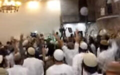 Screenshot from a video showing extremist Israeli Jewish wedding-goers celebrating the killing of the Dawabsha family. (screen capture: Channel 10)