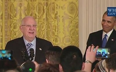 President Reuven Rivlin joins Barack Obama at a Hanukkah candle-lighting ceremony at the White House on December 9, 2015 (screen capture: YouTube)