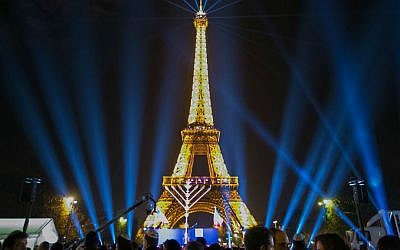 Thousands participate in Chabad-Lubavitch's annual public menorah lighting ceremony at the base of the Eiffel Tower in Paris on Sunday December 6, 2015, the first night of Hanukkah. (Chabad.org/Thierry Guez)