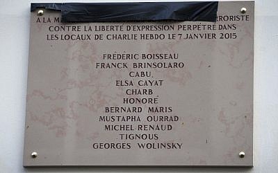 A picture taken on January 5, 2016 shows a memorial plaque bearing the names of the victims of the Charlie Hebdo attack on January 7, 2015. (AFP / JOEL SAGET)